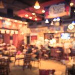 Blurred,Image,Sport,And,Gumbo,,Oyster,Bar,With,Tv,,Classic