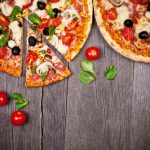 Delicious,Italian,Pizzas,Served,On,Wooden,Table