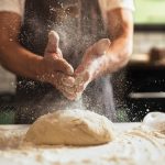 Chef's,Hands,Spraying,Flour,Over,The,Dough.,Kneading,Dough.,Male